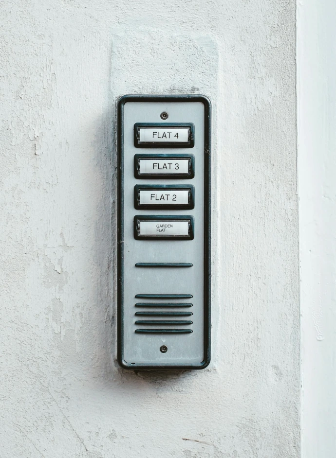 gray metal door with white wall